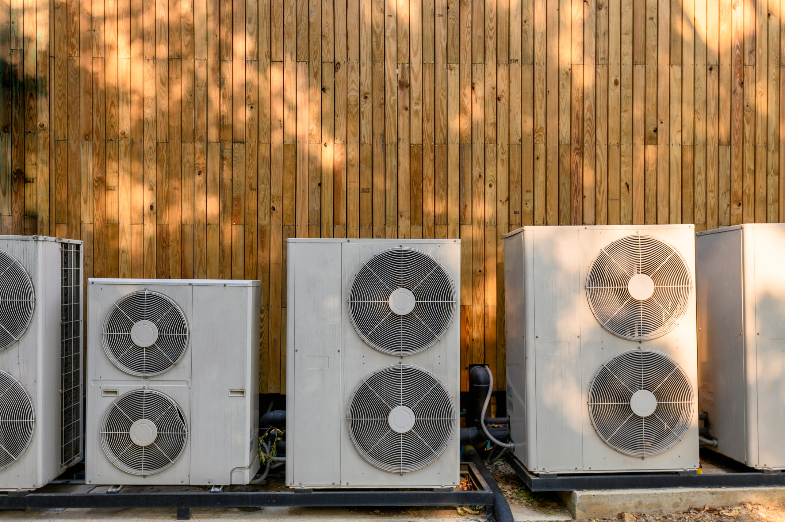 Many compressor air conditioning working on wooden wall