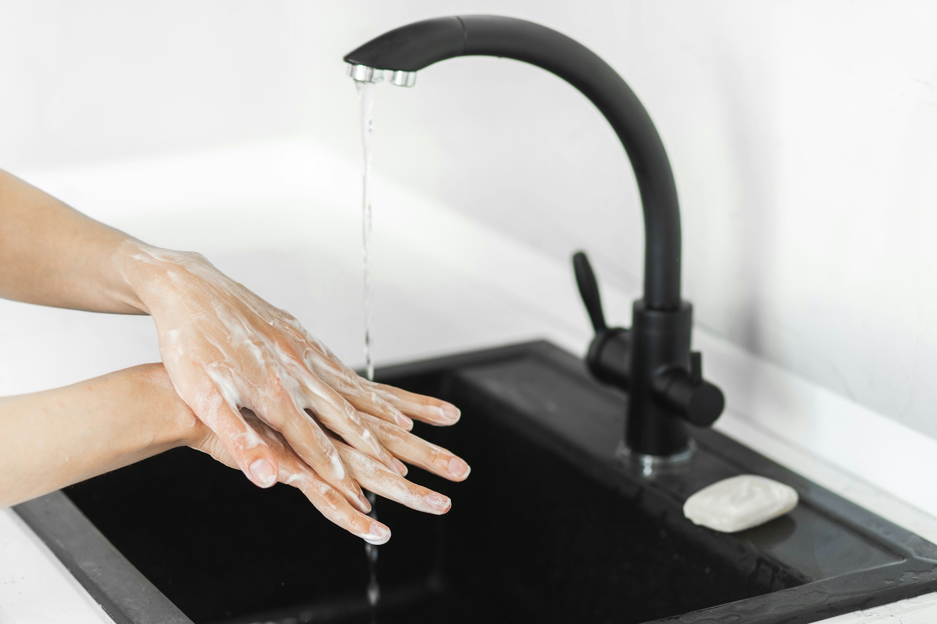 washing hands in the sink